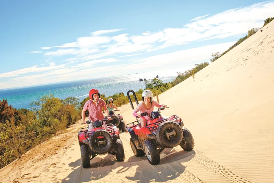 Moreton Island: Tangalooma Resort Cruise with Quad Bike Tour and Dolphin Feeding, Brisbane